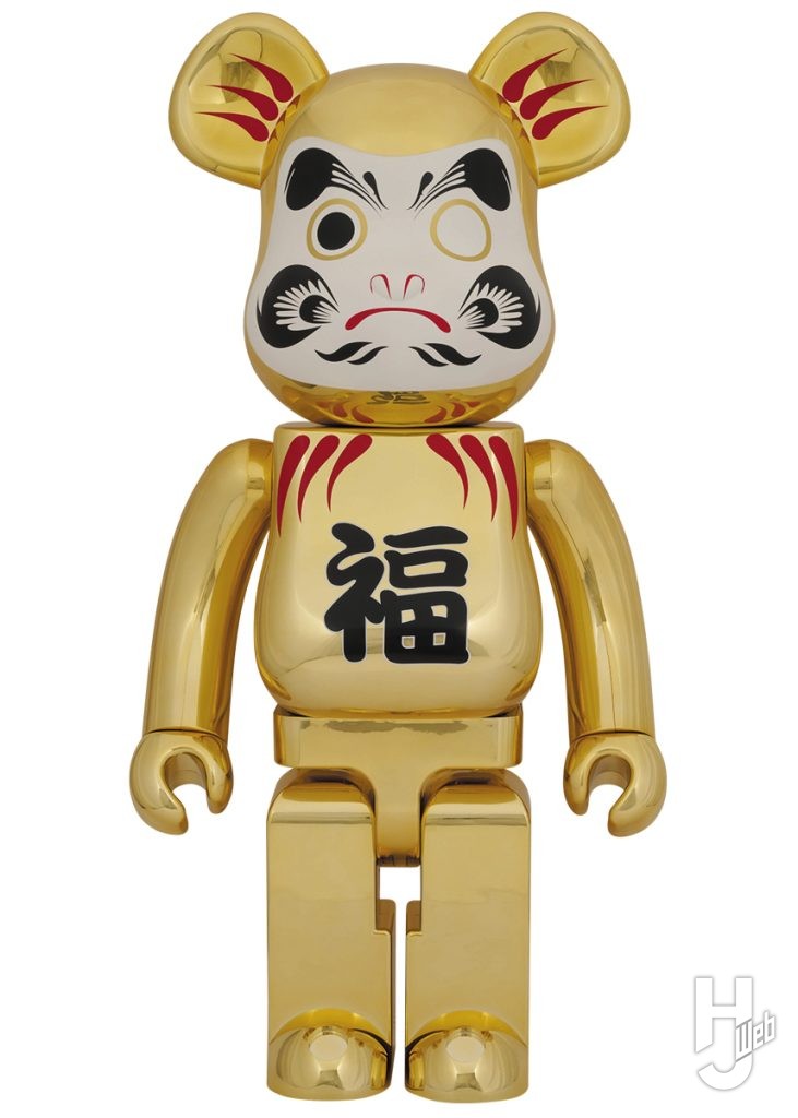 金メッキの達磨のベアブリックの画像